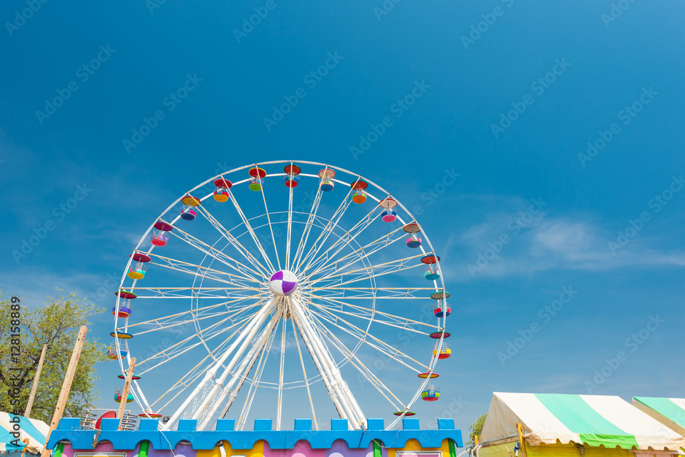 Giant Ferris wheel at the park with blue sky Giant Ferris wheel at the park with blue sky