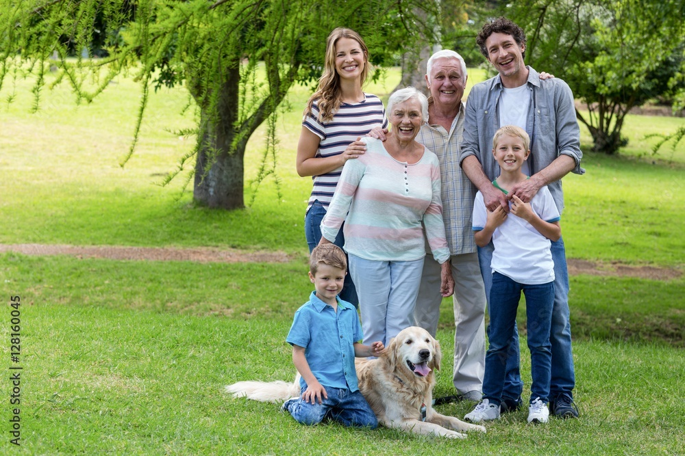 Obraz premium Family with dog in the park