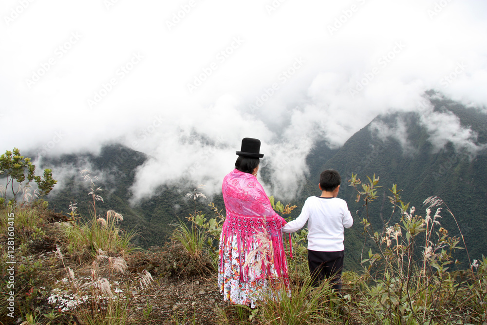 Obraz premium Bolivian mother and child enjoy the view of the mountains, Death road, Yungas region, Bolivia, South America