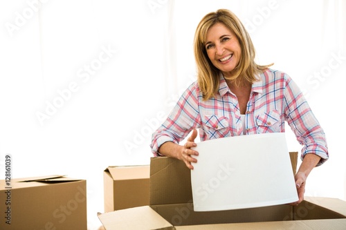 Woman opening a box