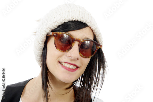 portrait of a pretty young brunette with winter hat, on white
