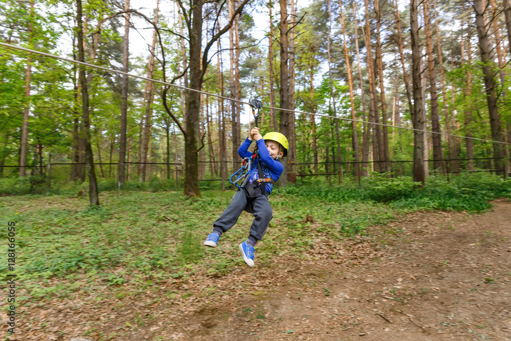 Obraz premium Little boy in climbing gear