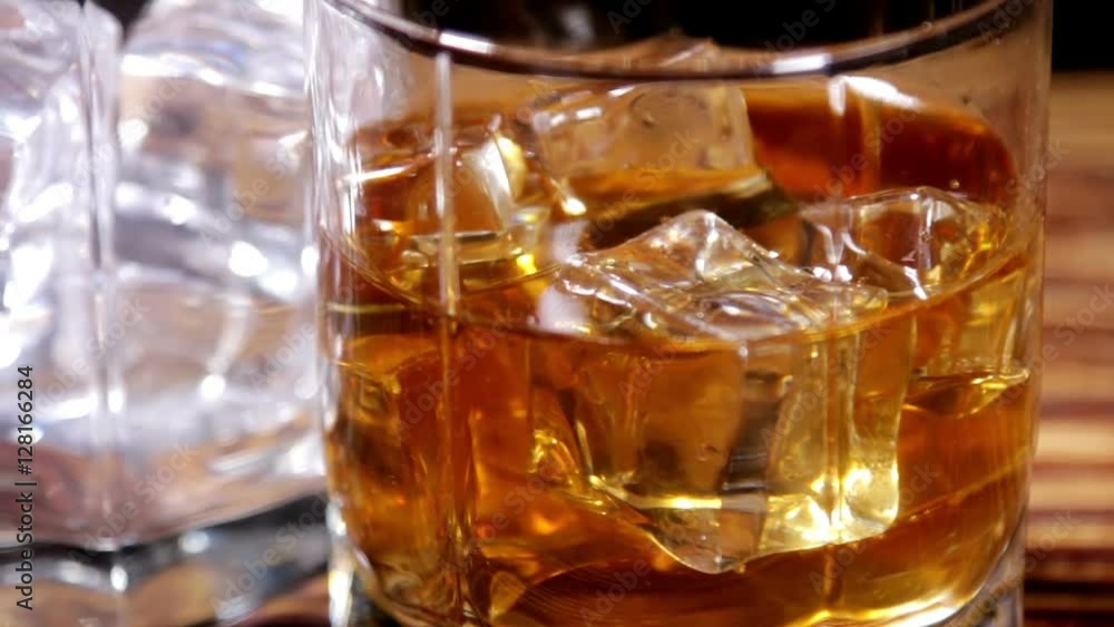 glasses of malt whiskey on a wooden table. video dolly glasses of malt whiskey on a wooden table. video dolly