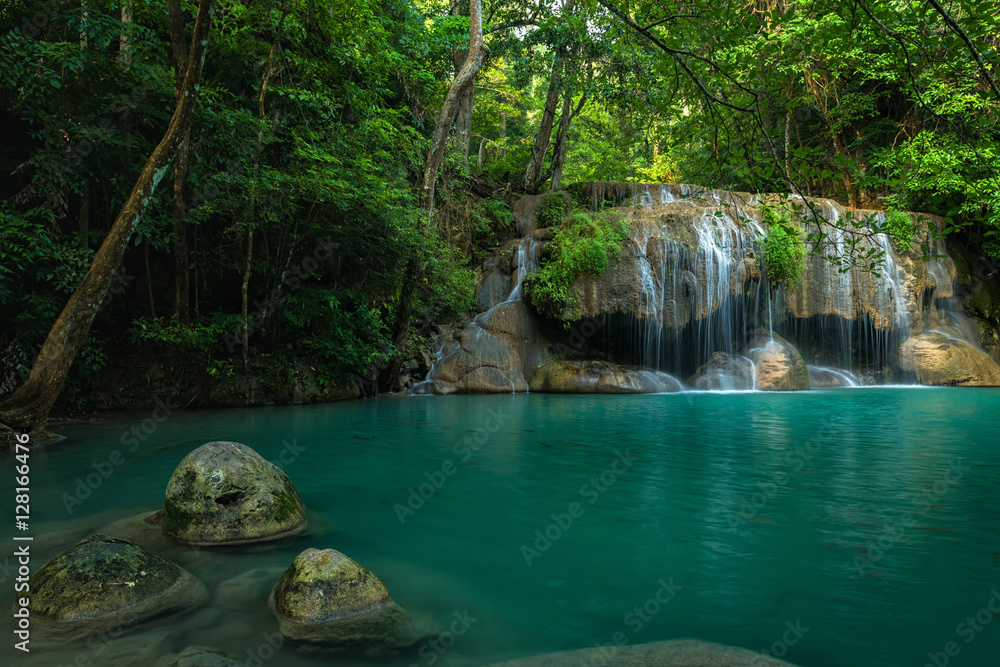 Naklejka premium Breathtaking green and clean waterfall in deep forest, Erawan's waterfall, Located Kanchanaburi Province, Thailand