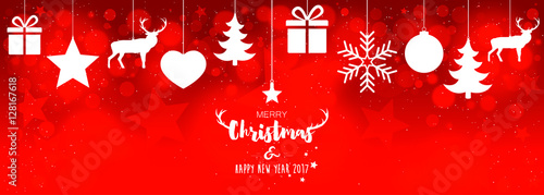 Christmas card with hanging decorations on red bokeh