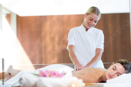 Woman receiving a back massage photo