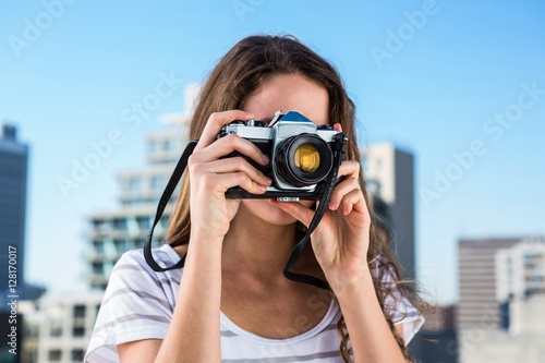 Young girl taking photos 