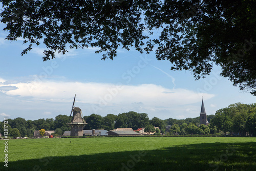 Dutch village with windmill and church. Country life. Vilsteren Overijssel Netherlands. photo