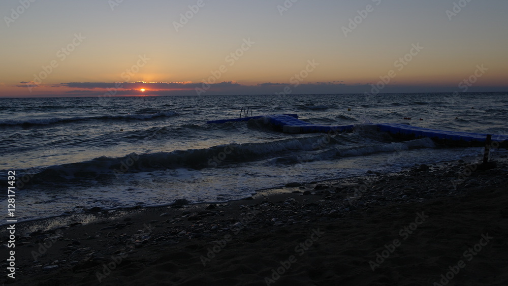 A perfect sunrise over an agitated sea