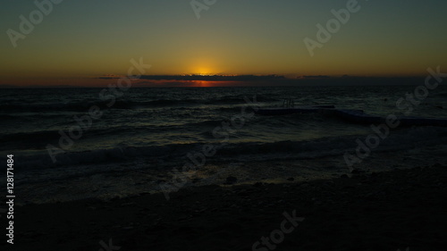 A perfect sunrise over an agitated sea © VladFlorin