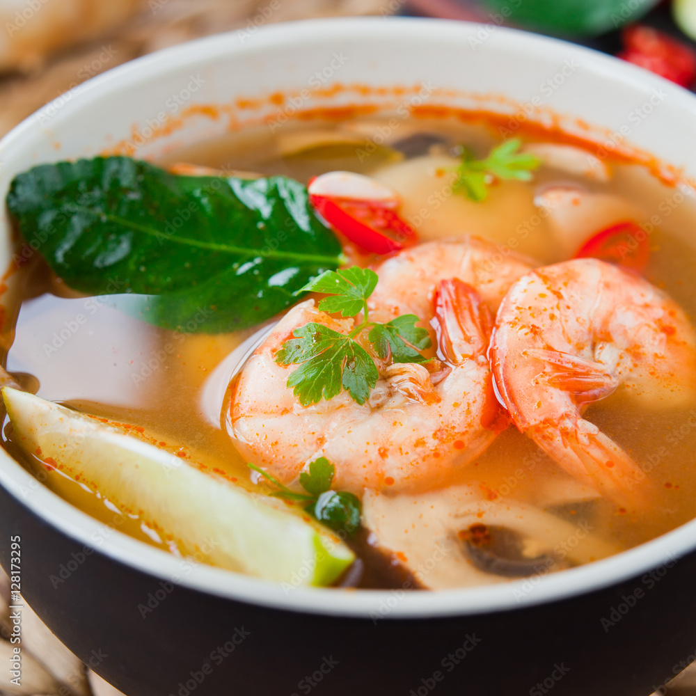 Tom Yum goong nam sai ต้มยำกุ้งน้ำใส - famous broth Thai soup with prawns  and kaffir leaves. Stock Photo | Adobe Stock
