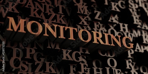 Monitoring - Wooden 3D rendered letters/message. Can be used for an online banner ad or a print postcard.