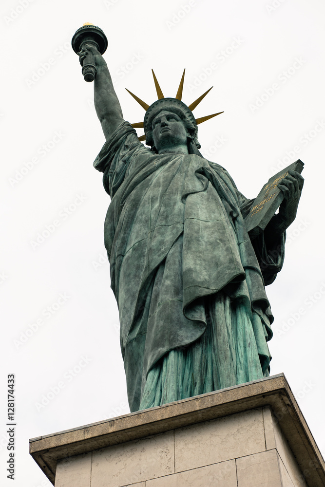Fototapeta premium Replica of the Statue of Liberty near the Eiffel Tower on the Isle of the Swans, a man-made island in the Seine. (Paris, France)