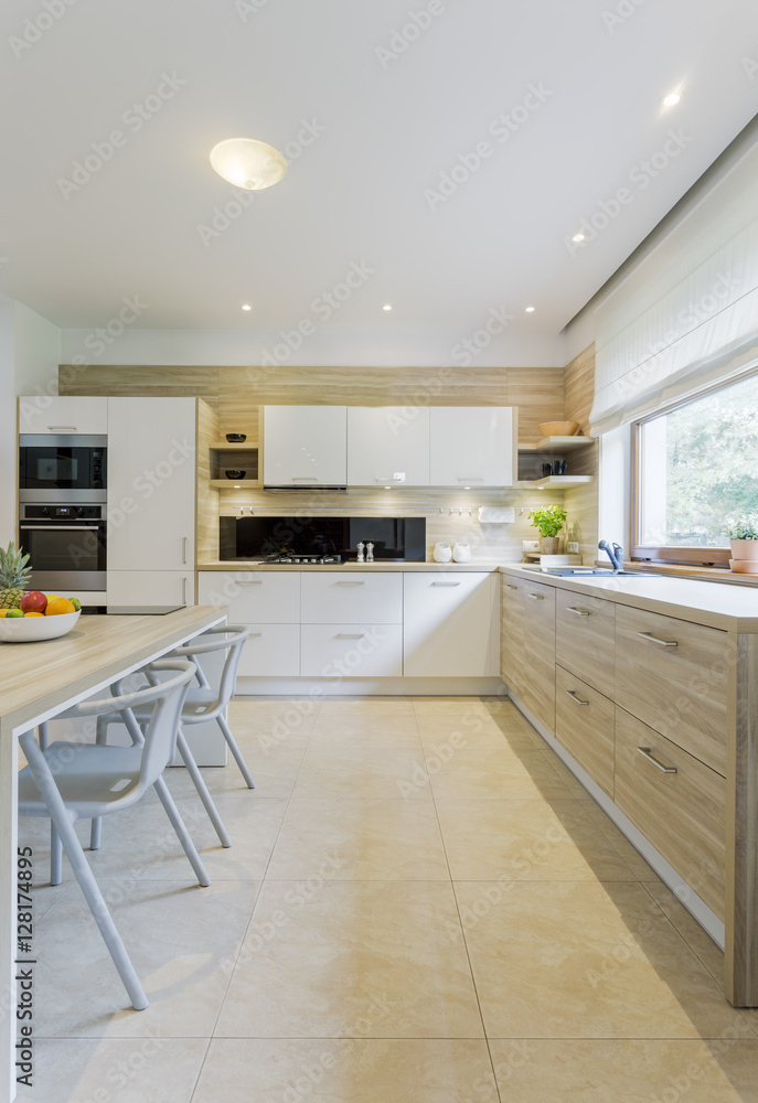 Fototapeta premium Modern kitchen filled with freshness and air