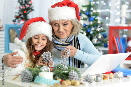 Grandmother and child preparing for Christmas
