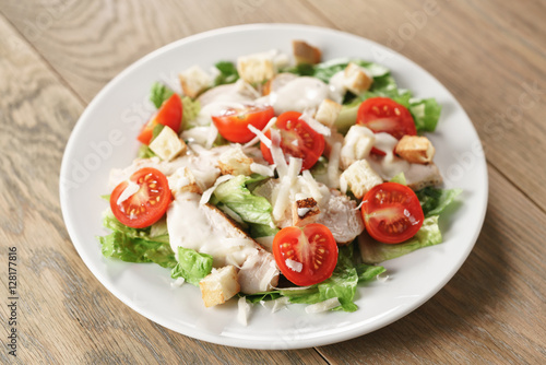caesar salad with red cherry tomatoes, shallow focus