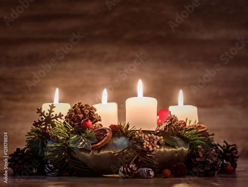 Advent wreath with four burning candles 