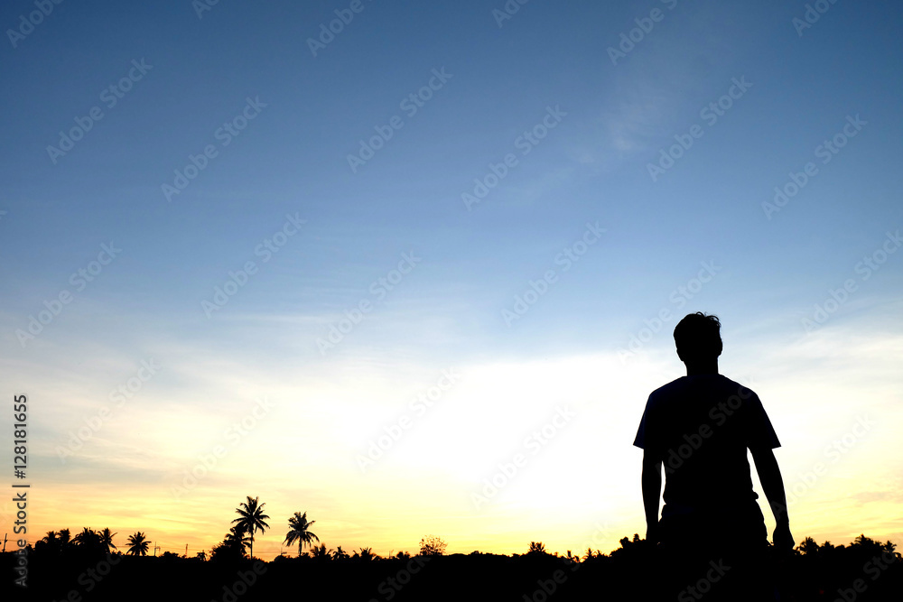 Silhouette of man on sky background 