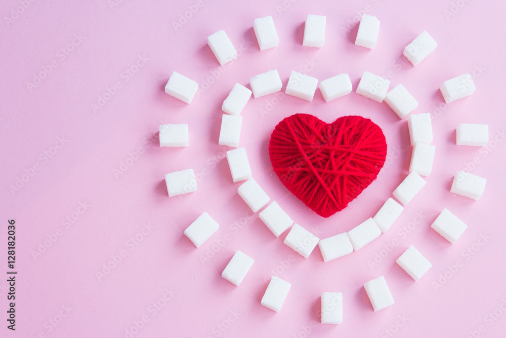 Red heart and sugar cubes on a pink background Stock Photo | Adobe Stock