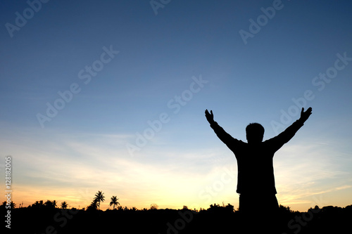 Silhouette of man on sky background 