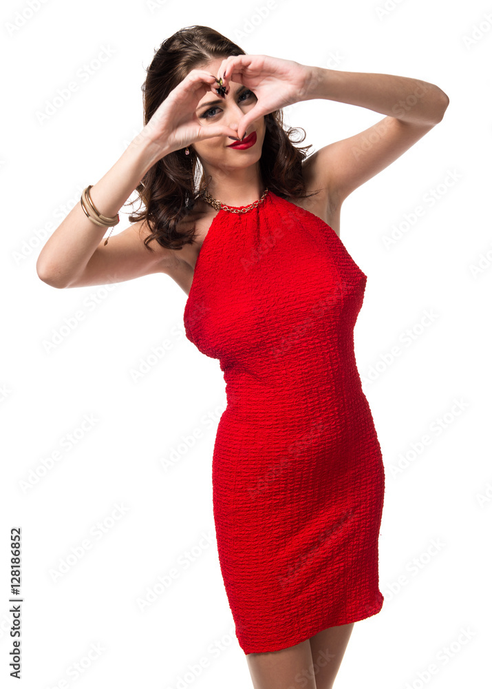 Pretty young girl making a heart with her hands Pretty young girl making a heart with her hands