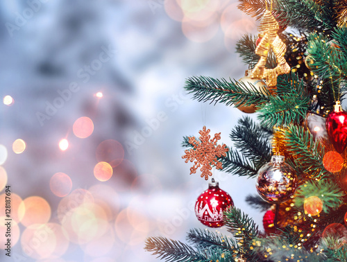 Christmas tree background and Christmas decorations with snow  blurred  sparking  glowing. Happy New Year and Xmas theme