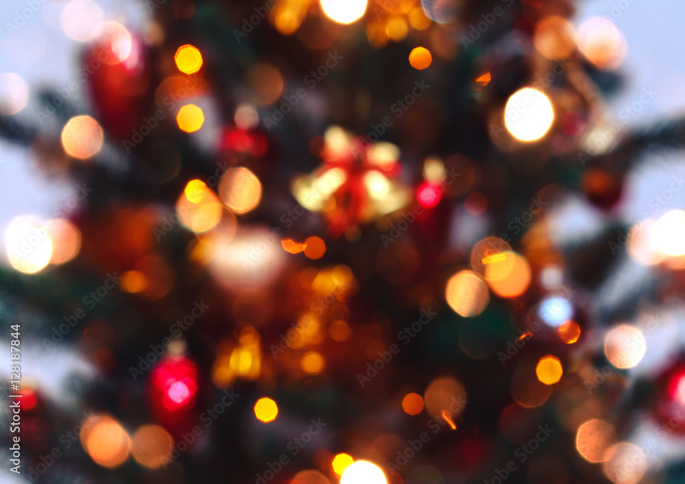 Christmas tree background and Christmas decorations with snow, blurred, sparking, glowing. Happy New Year and Xmas theme