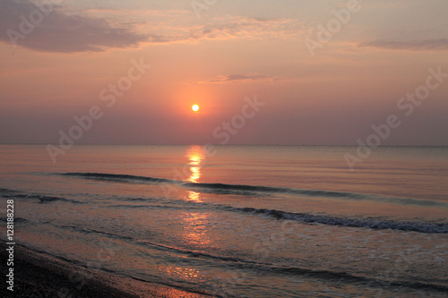 Sunrise water reflection at seaside
