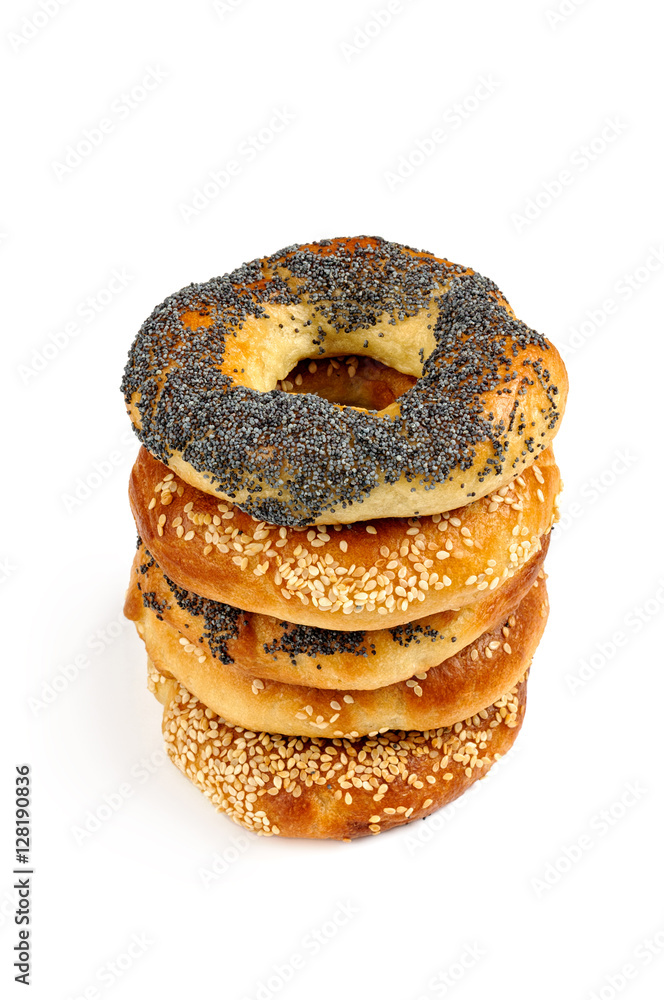Stack of Poppy and sesame bagels on a white background Stack of Poppy and sesame bagels on a white background