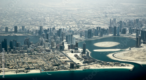 Aerial view of Dubai bay with skyscrapers