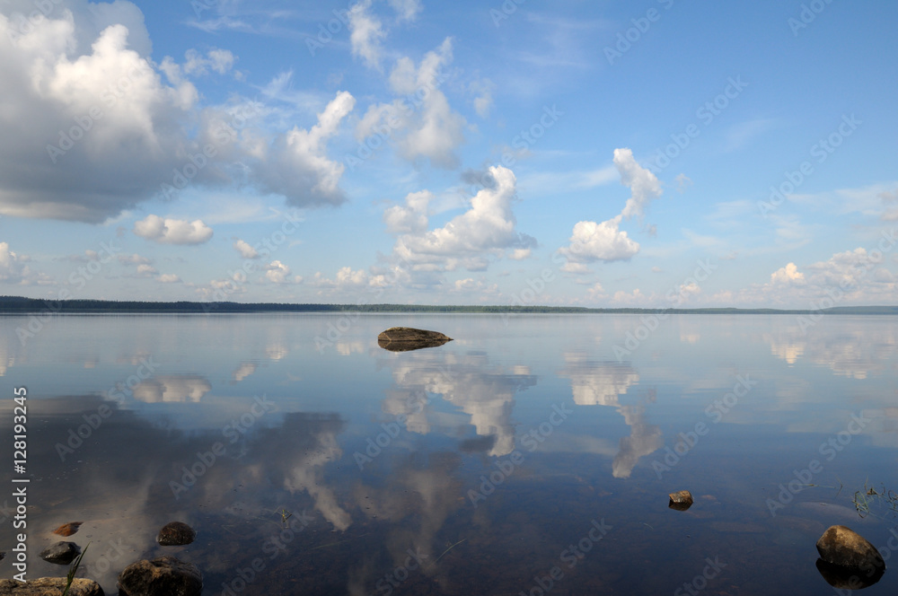 Stone in the mirror line of Karelian lake