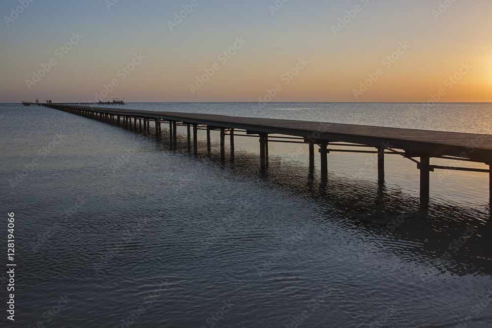 Wooden pier in Red Sea at dawn