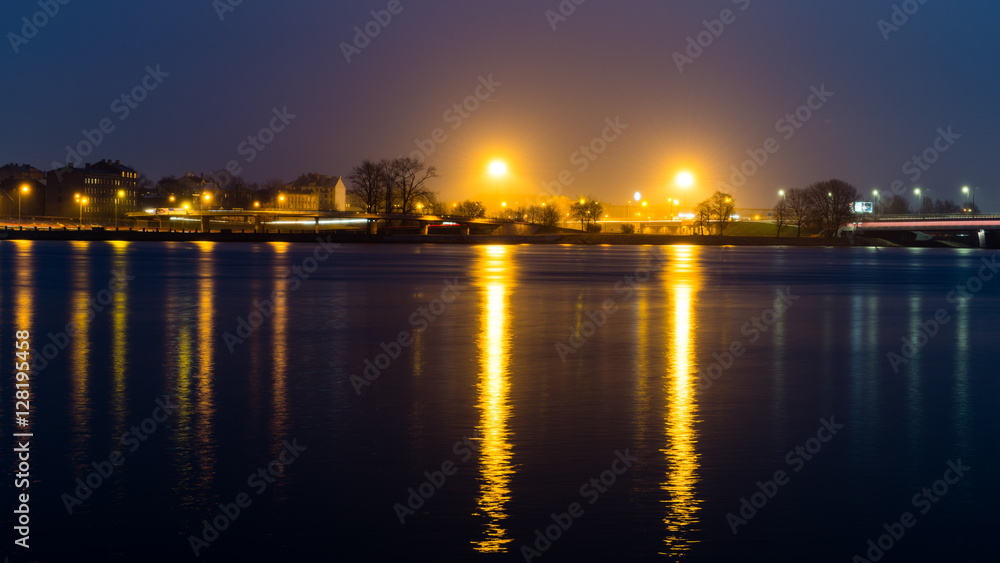summer night city light reflections over water