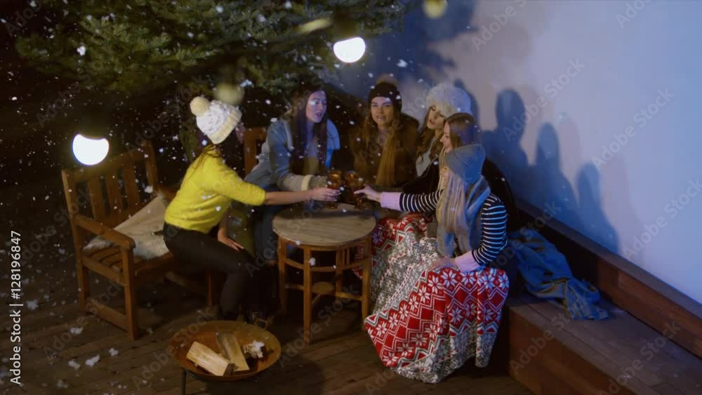 HIGH ANGLE Happy female friends meeting and drinking hot beverages outdoors in winter. 60 FPS slow motion, 4K UHD RAW edited footage HIGH ANGLE Happy female friends meeting and drinking hot beverages outdoors in winter. 60 FPS slow motion, 4K UHD RAW edited footage