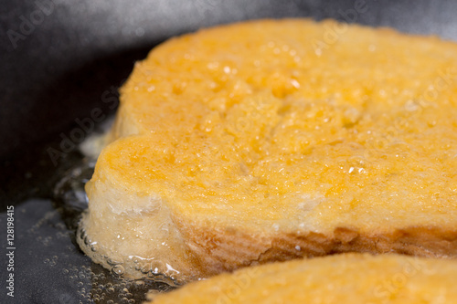 Frying french toast in frying pan