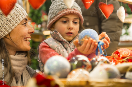 Christmas ball enchanted a girl on the christmas market