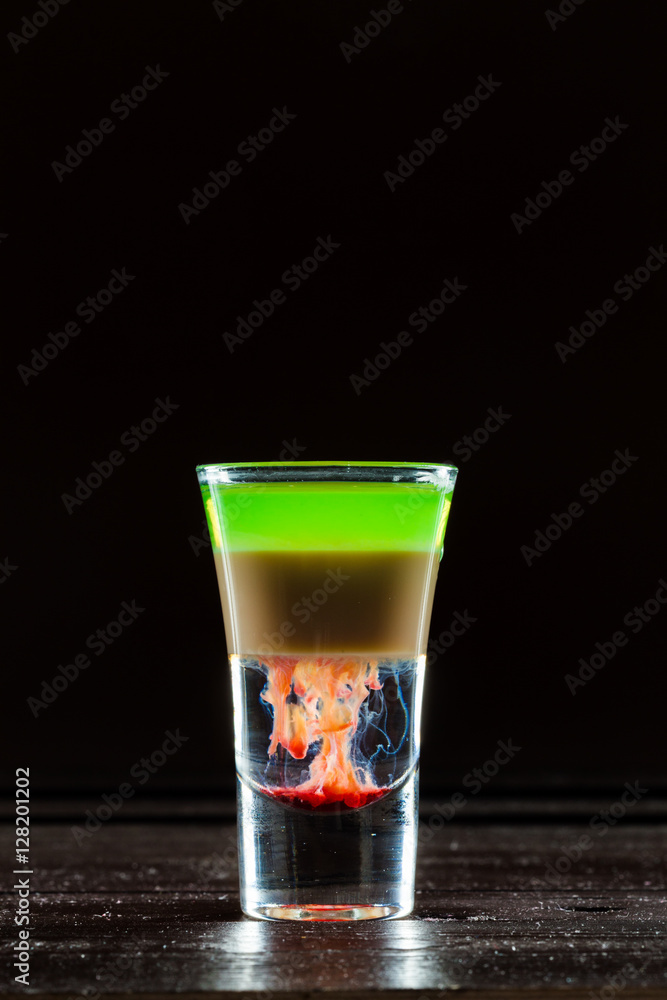 Colorful alcoholic cocktail in a shot glass Colorful alcoholic cocktail in a shot glass
