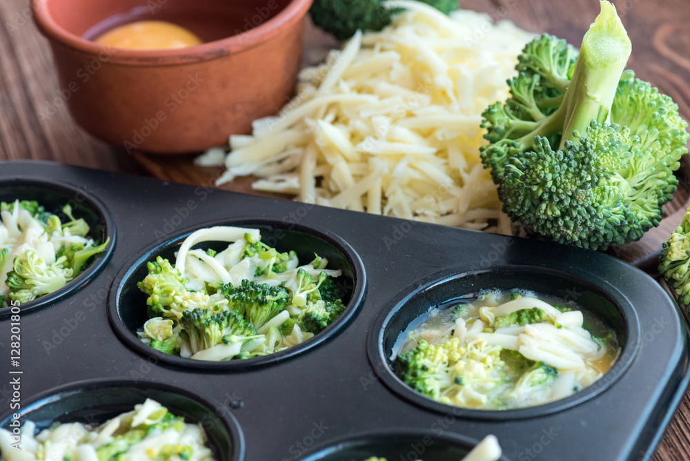 Delicious egg muffins broccoli and cheese. Concept of cooking. Delicious egg muffins broccoli and cheese. Concept of cooking.