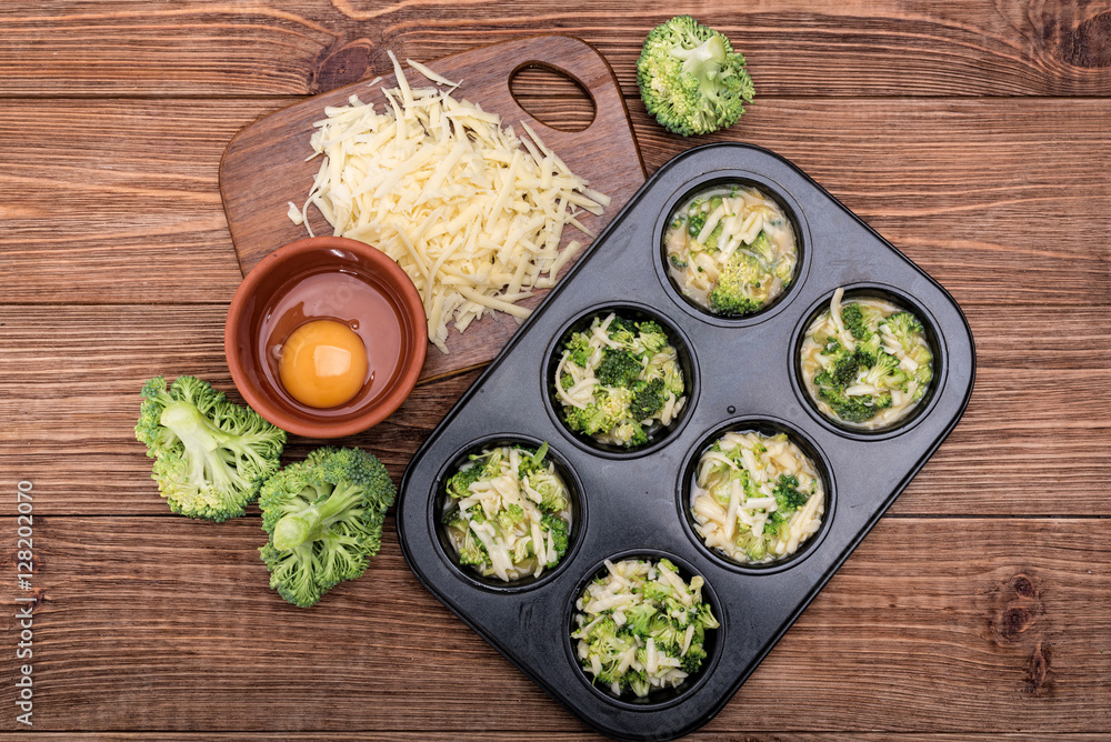 Fototapeta Delicious egg muffins broccoli and cheese. Concept of cooking.