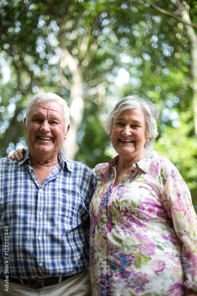 Portrait of happy couple against trees Portrait of happy couple against trees