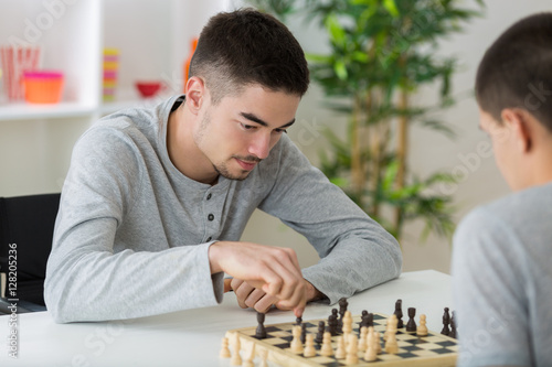 two students playing chess