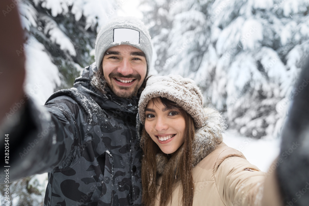 Man Taking Selfie Photo Young Romantic Couple Smile Snow Forest Outdoor Winter Pine Woods Man Taking Selfie Photo Young Romantic Couple Smile Snow Forest Outdoor Winter Pine Woods