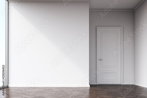 Empty room with white walls and dark wood floor