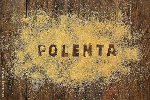 Gluten free flour polenta with text on brown wooden background