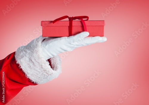 Santa claus holding a christmas gift