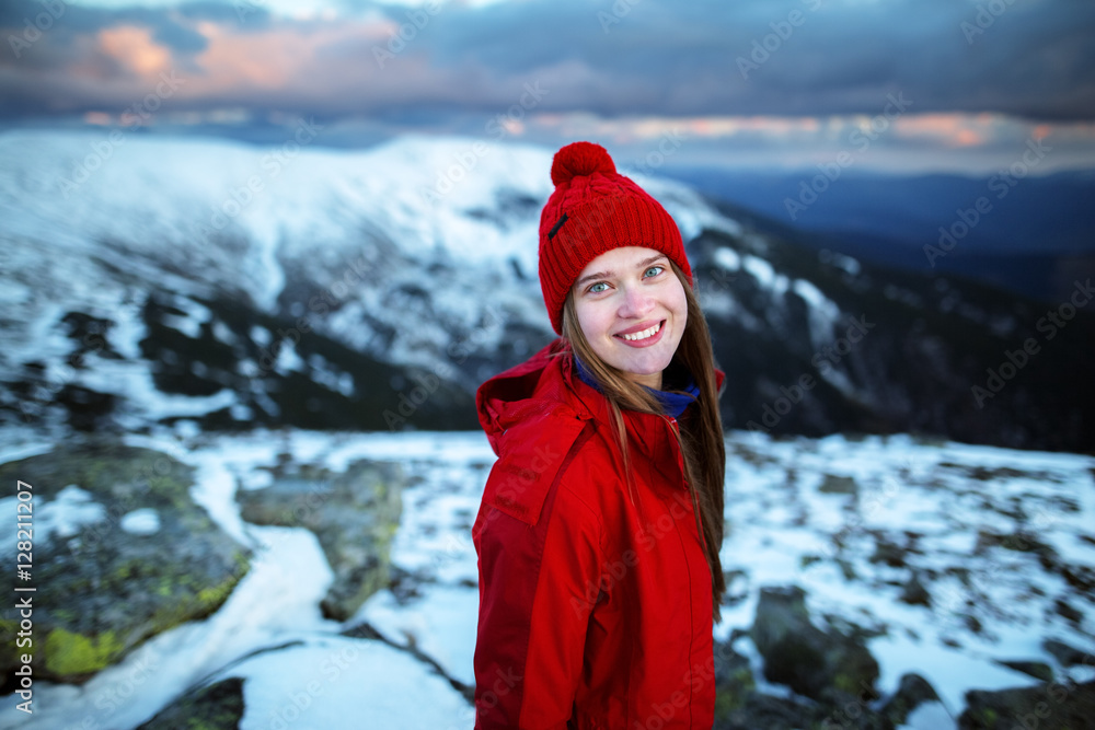 Portrait of a young woman hiking in the mountains