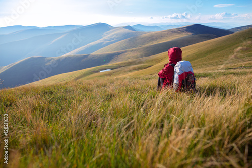 Shot of a young woman looking at the landscape while hiking in the mountains © Serhii