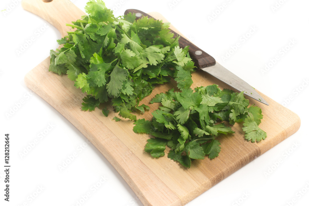 Fresh Coriander over a wooden board Fresh Coriander over a wooden board