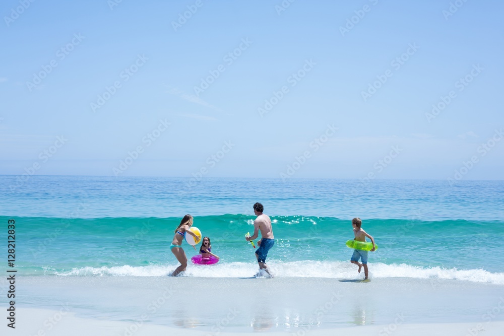Family playing at sea shore