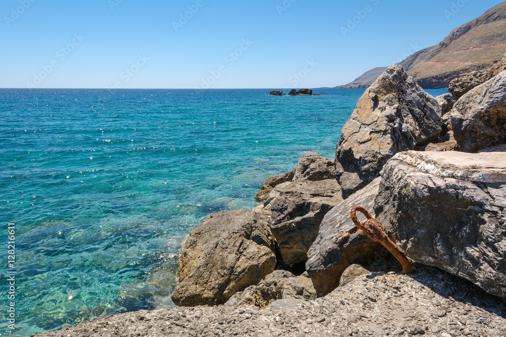 Beautiful rocky shore with turquoise water in southern part of the Crete island. Greece. Coast of Libyan sea.